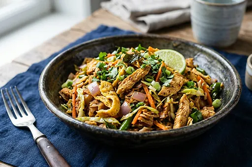 Kottu roti with vegetables, eggs and curry spices