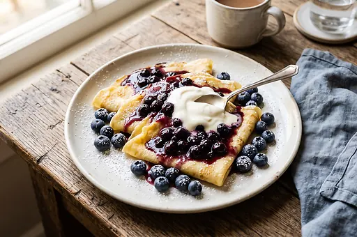 Blueberry crepes with sour cream